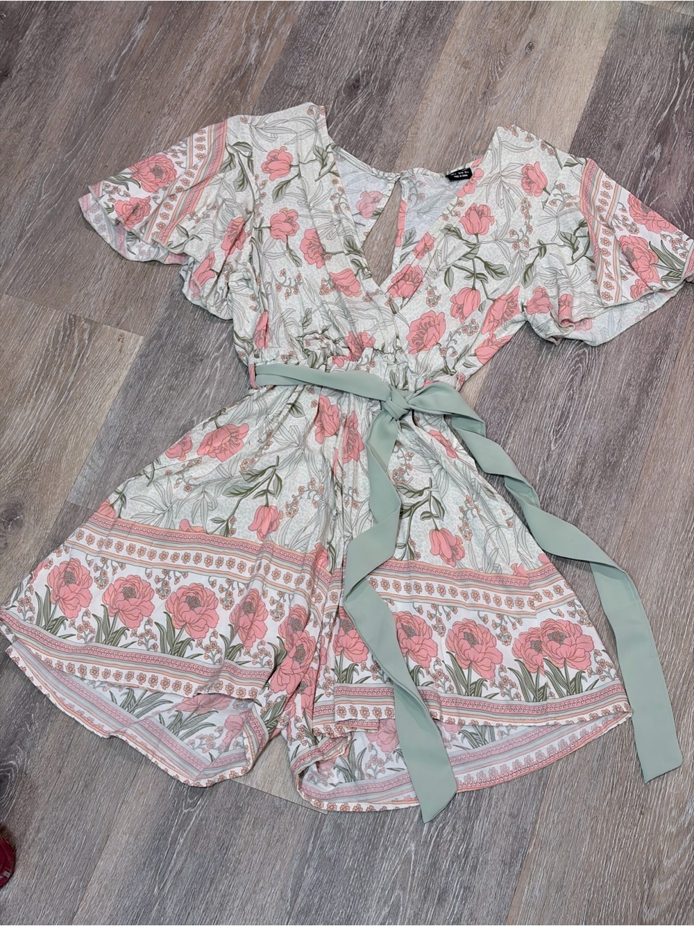 Floral V neck Romper with Sage Tie and flutter sleeve cream salmon sage
